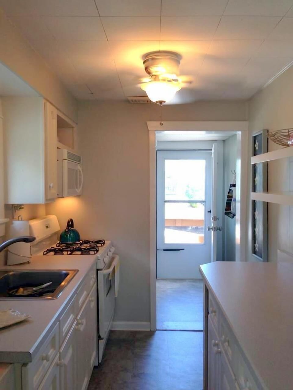 2nd Floor Kitchen - w/d, fridge, & door that access backyard for BBQ & storage