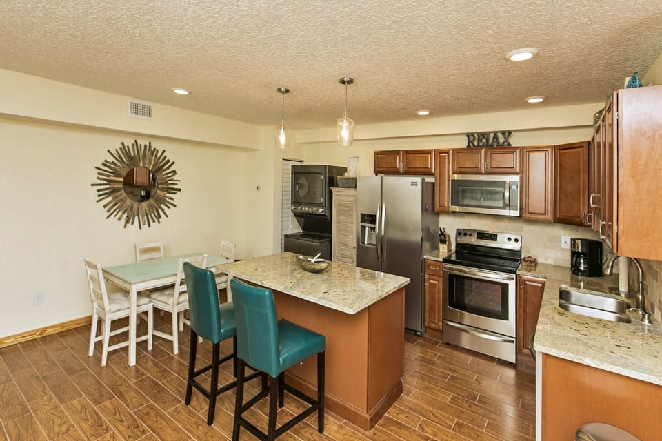 Gourmet Kitchen with Large Island, Granite Countertops and Stainless Appliances