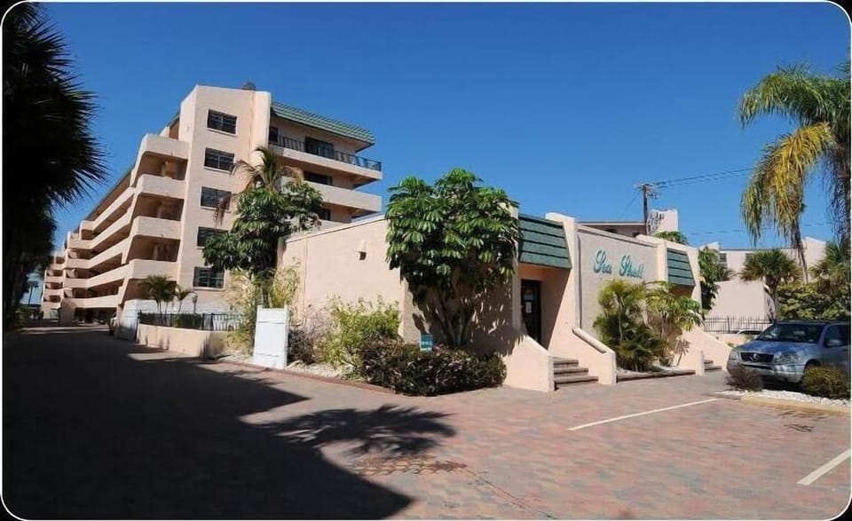 Top Unit facing pool with wrap around balcony