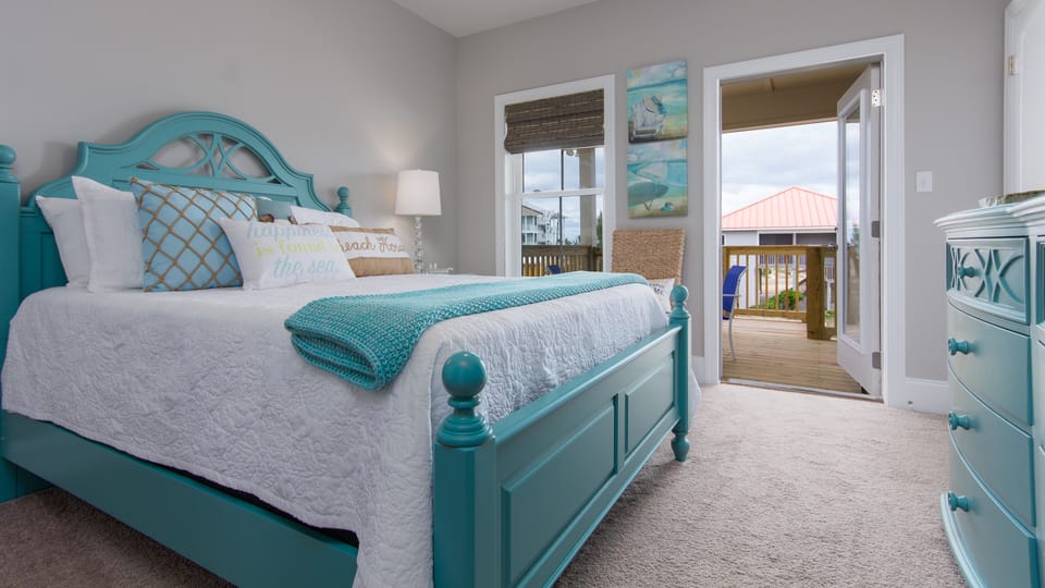 Queen room with exterior exit to the back deck.