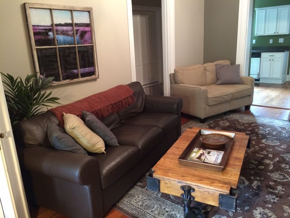 The cozy living room has a 52' HDTV with plenty of comfortable seating.