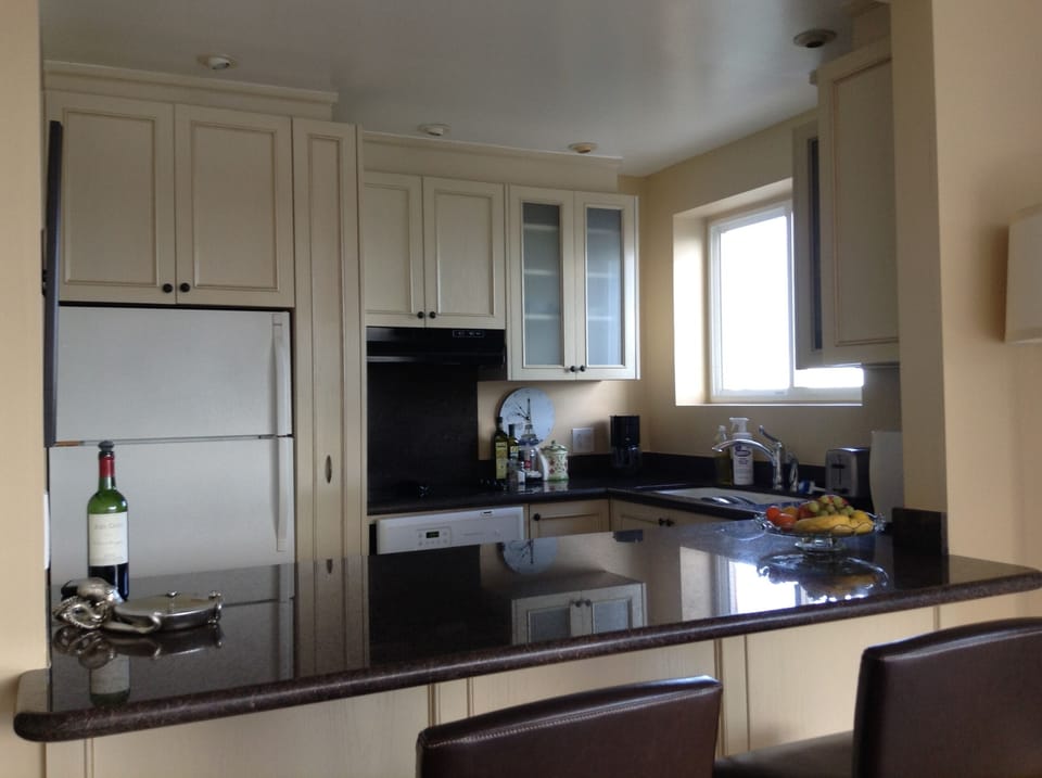 Joins living room. Excellent for conversations while preparing a meal.