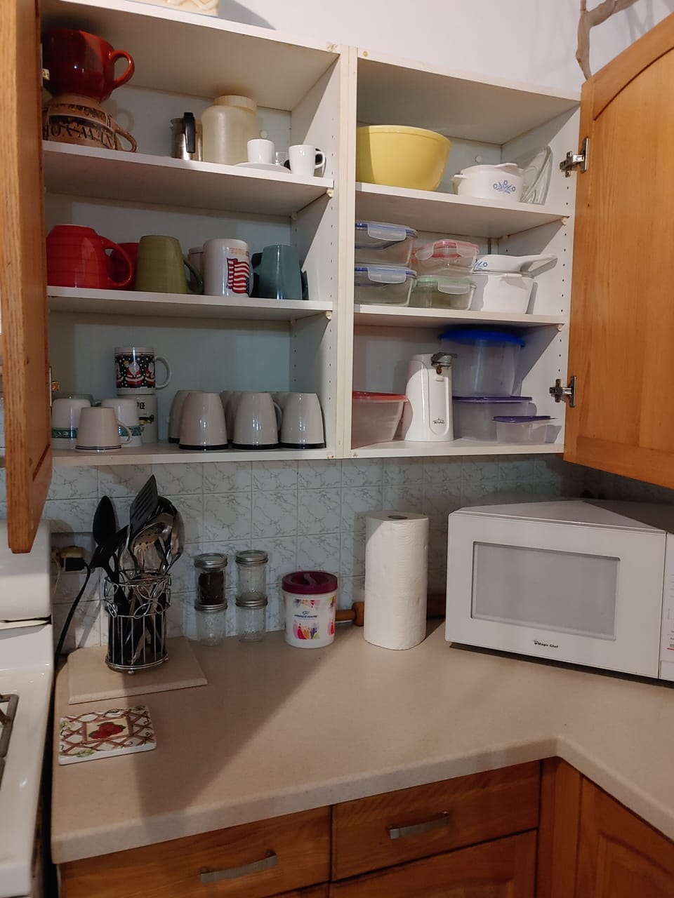 More kitchen cabinets and microwave.