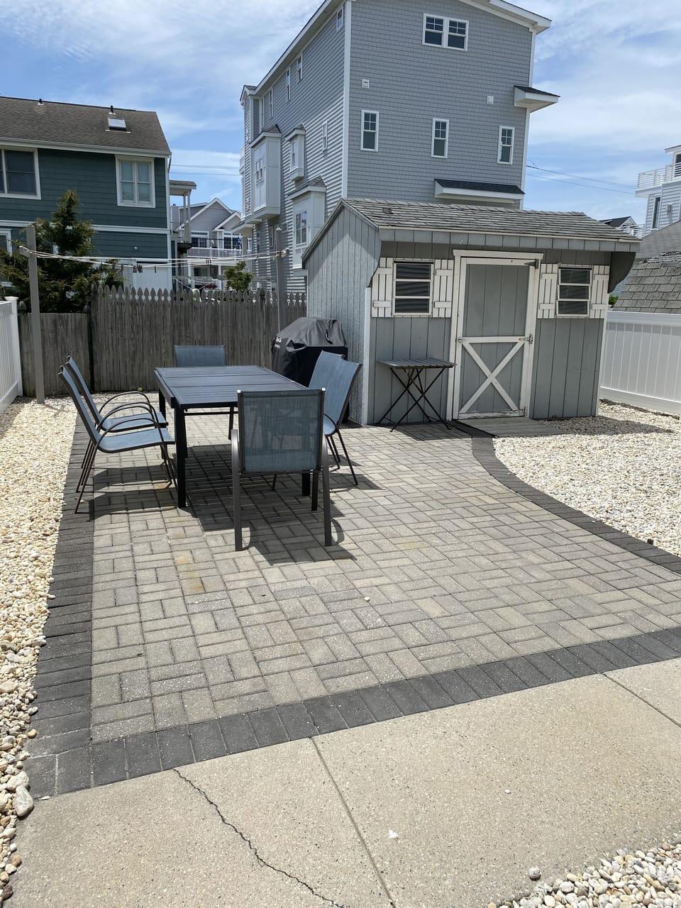 Backyard stone patio with grill.  Great place to hang at night.