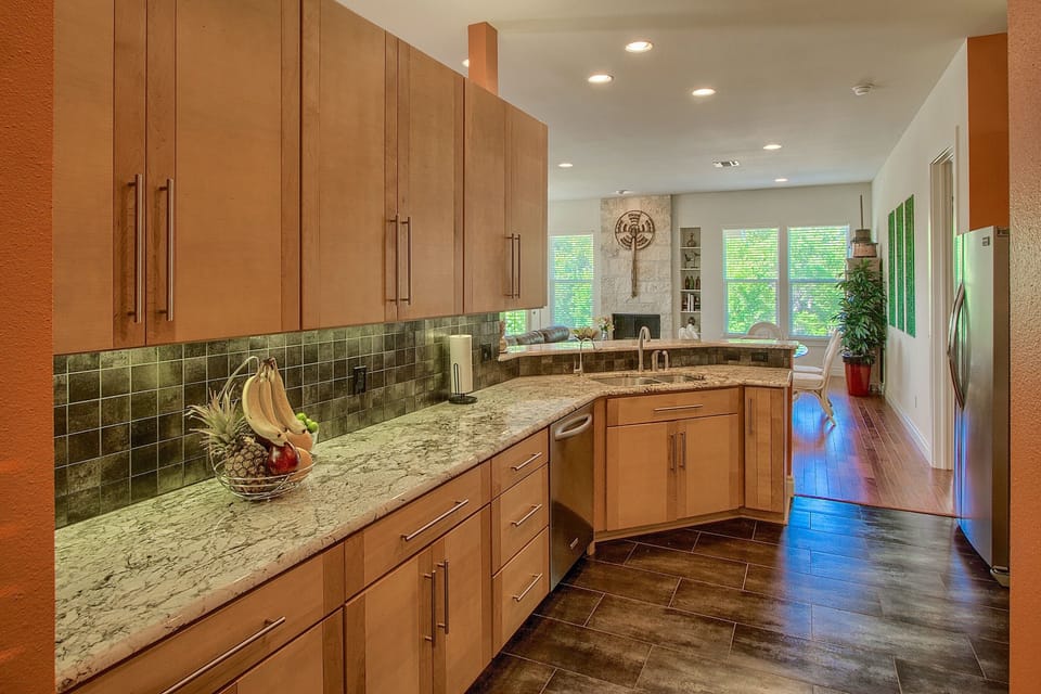 Large granite top work space and undercounter lighting.