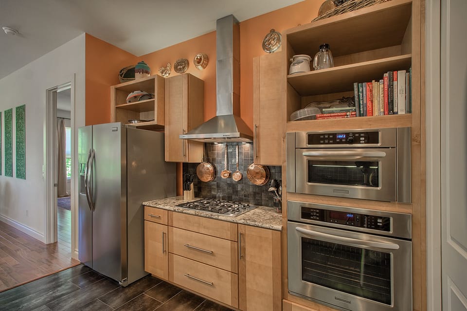 Stainless appliances, gas range,  KitchenAid microwave, & convection oven.