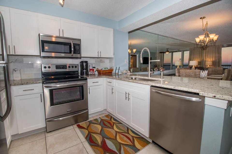 Kitchen with stainless appliances and granite countertops.
