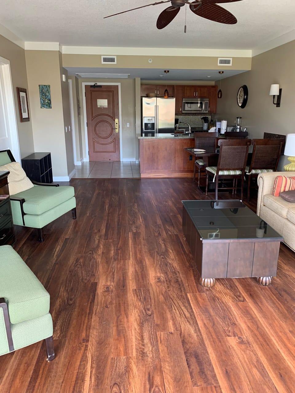 Spacious living room with new floors and open kitchen. 