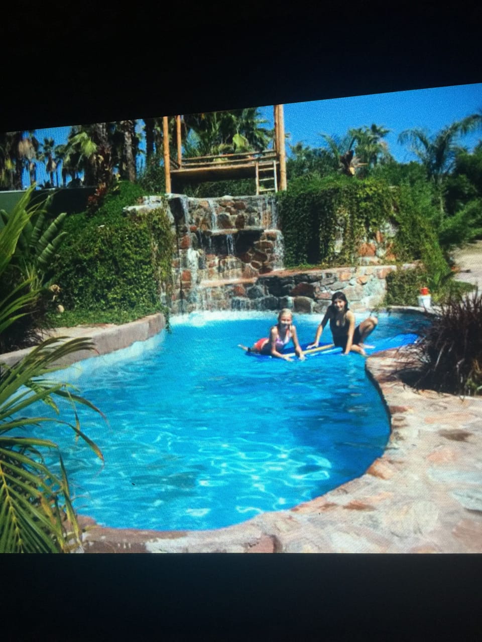 Awesome swimming pool with waterfall