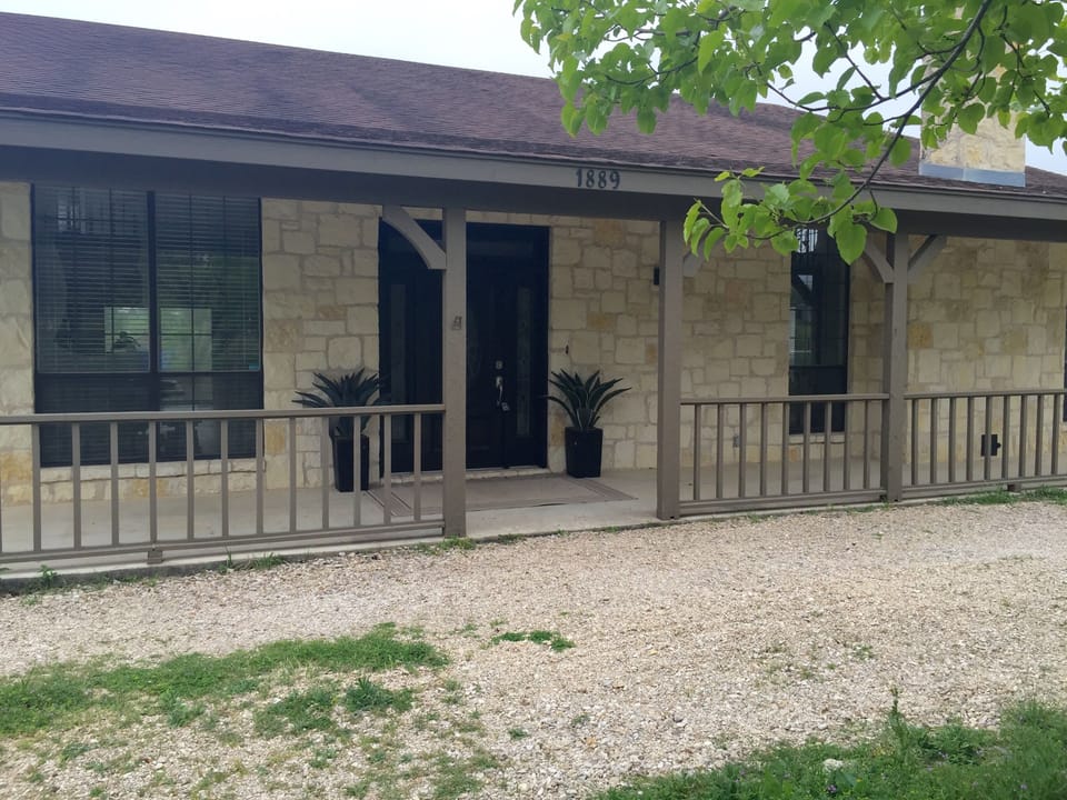 Exterior w/ covered patio to welcome guests. Plenty of parking in circular drive