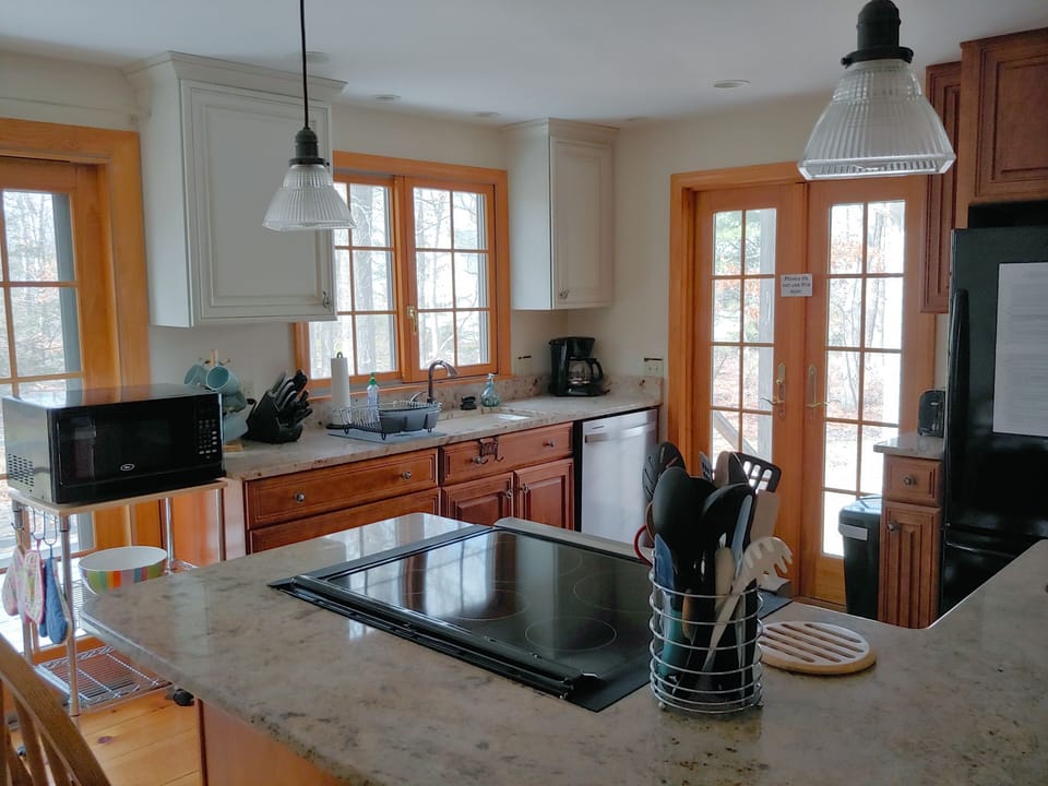 Kitchen with new stove and dishwasher, plus disposal