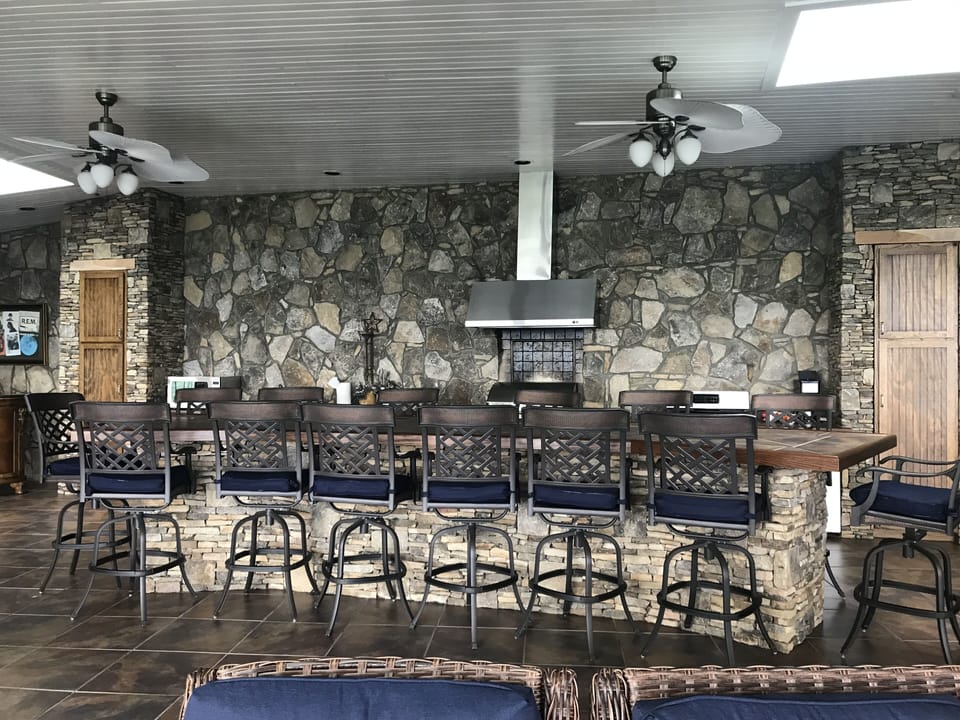 Pavilion kitchen and very large bar with seating for 14