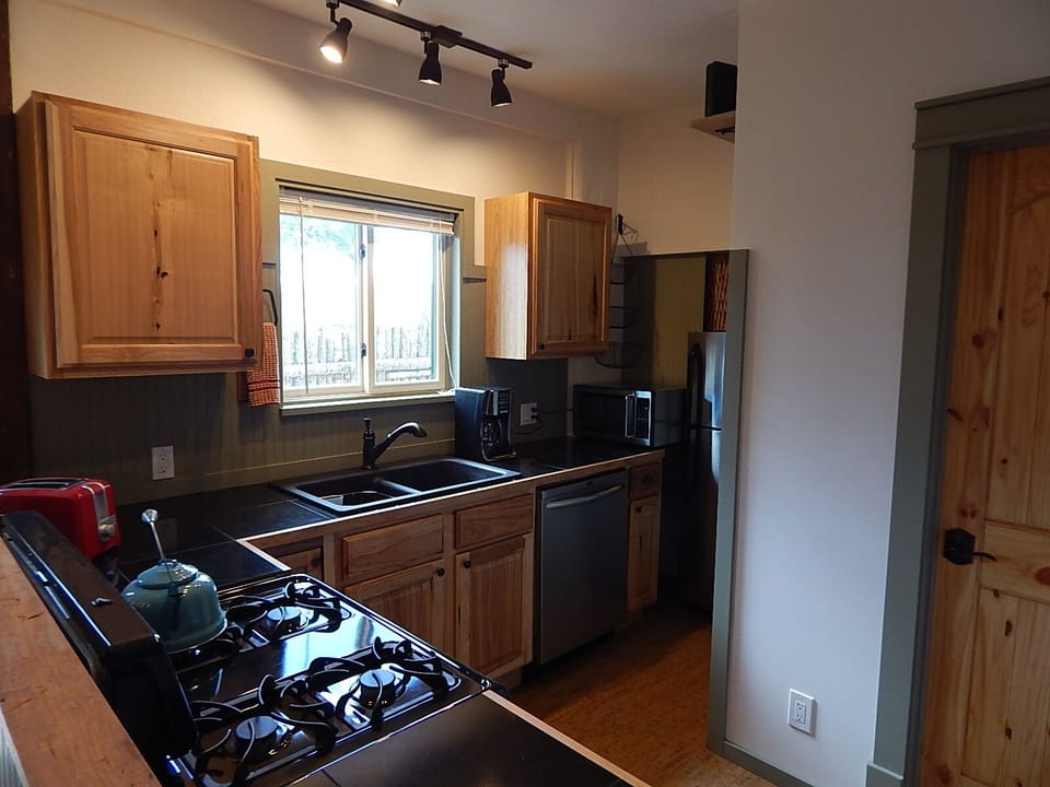 View of Kitchen.
Fully equipped with dishwasher, microwave,  and coffee maker.