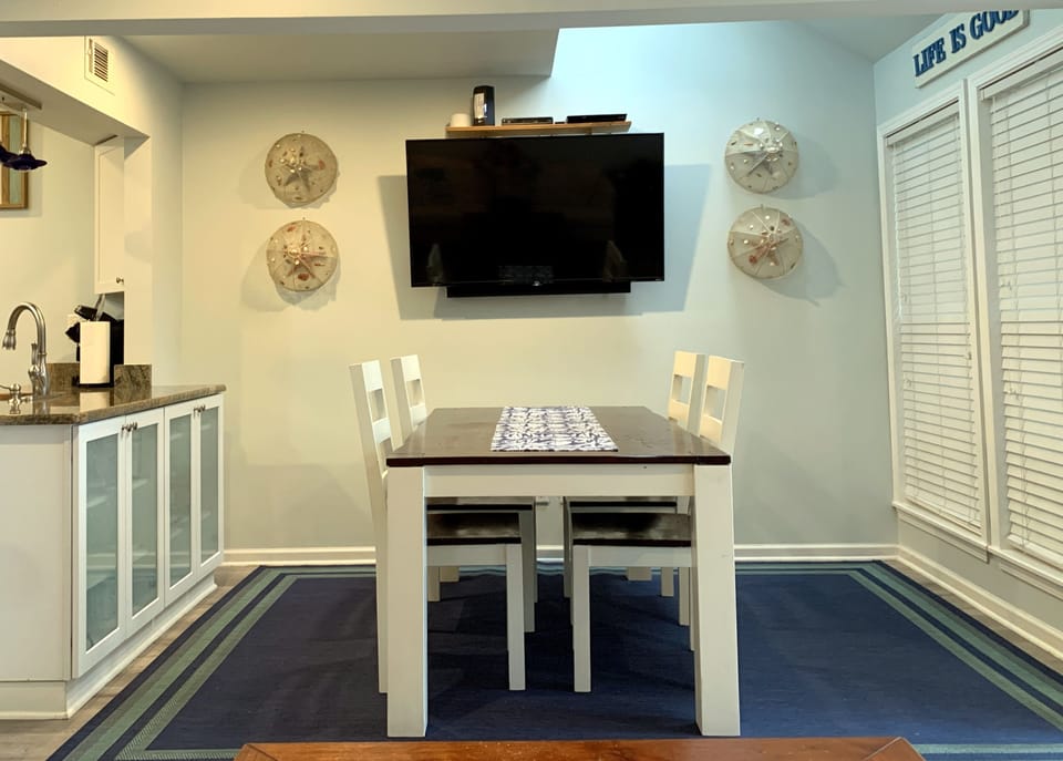 Dining table with seating for 4.  Two extra chairs (in closet) if needed.