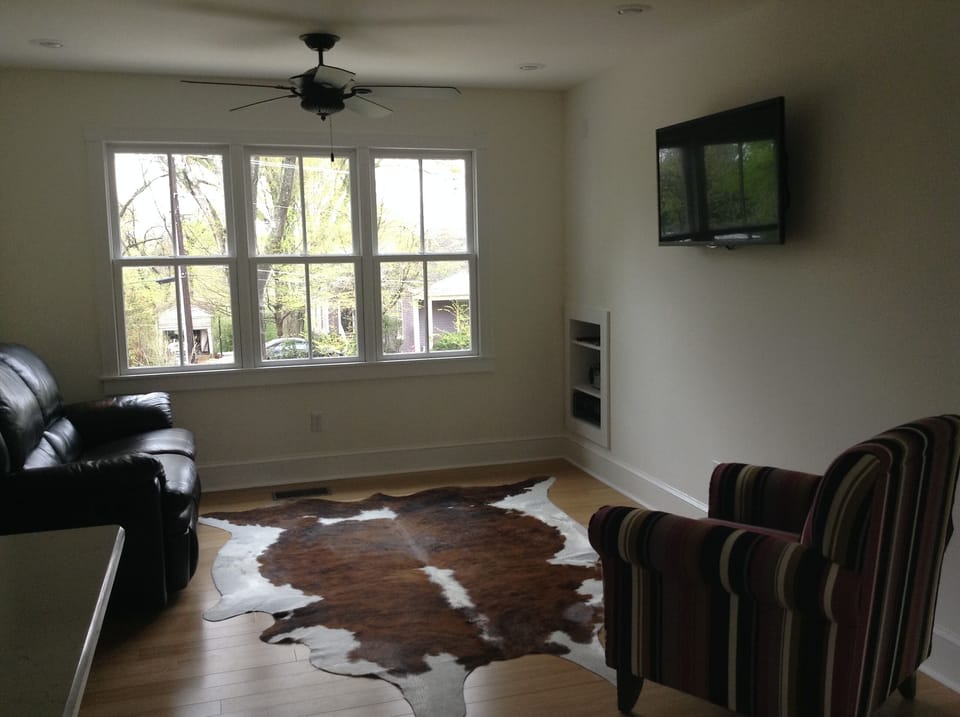 Living room area.  Lots of natural light and great view.