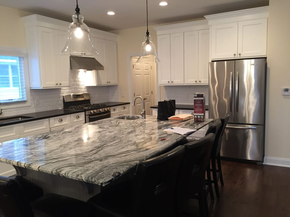Center Island, stove, pantry (small office is through pantry), SS refrigerator