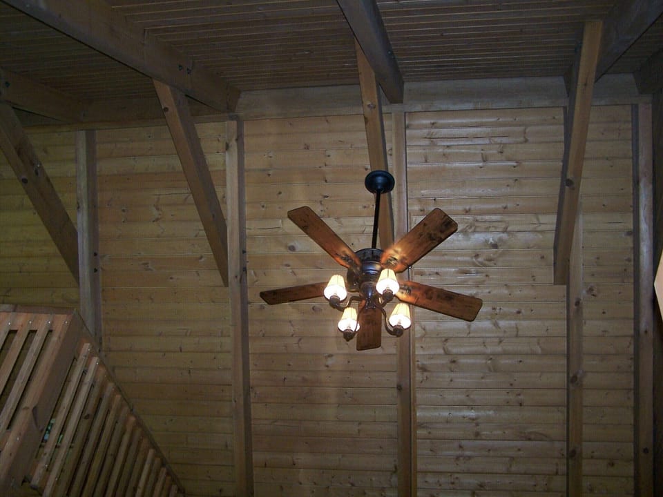Living room ceiling open up to the roof beams.