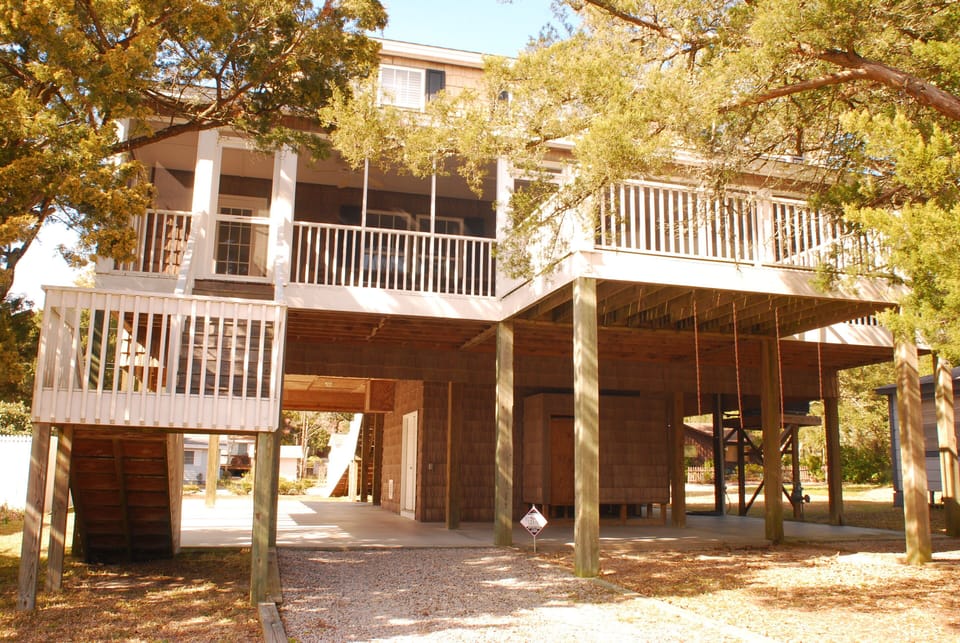 Entrance from beach. Outdoor shower below, screened porch above.