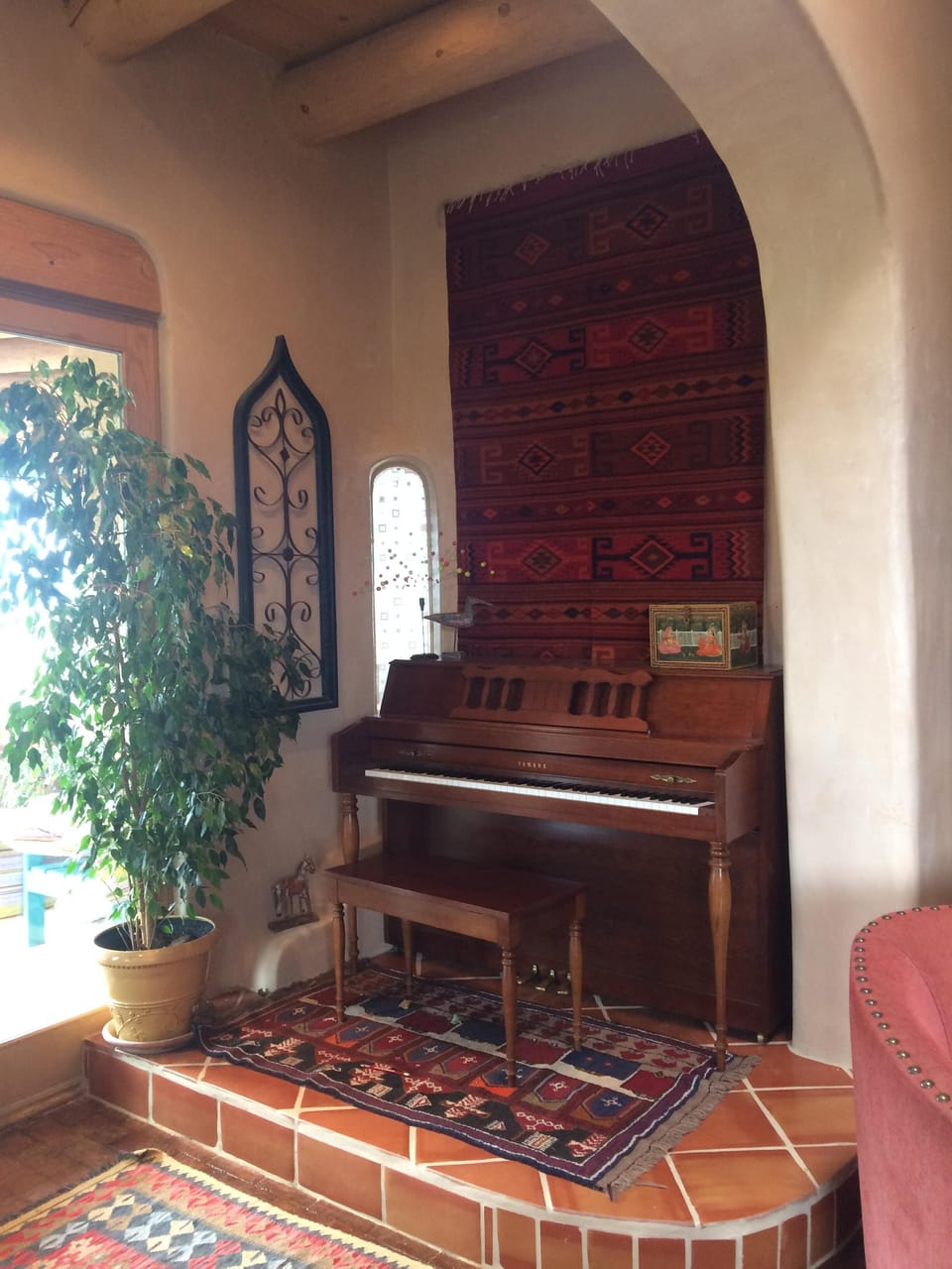 Inviting piano nook as you enter the house from the patio.