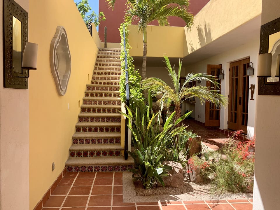 Stairs leading upstairs to the master bedroom, barbecue and the viewing tower.