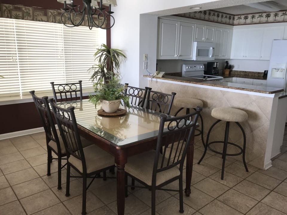Dining / Fully equipped Kitchen Area with radiant top stove & microwave.