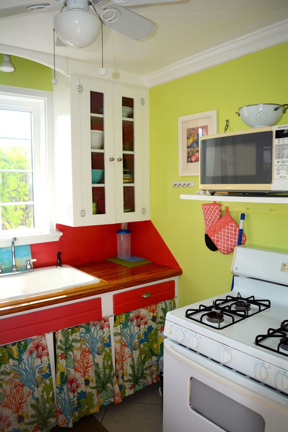 Kitchen with full size stove, oven, microwave and refrigerator. 
