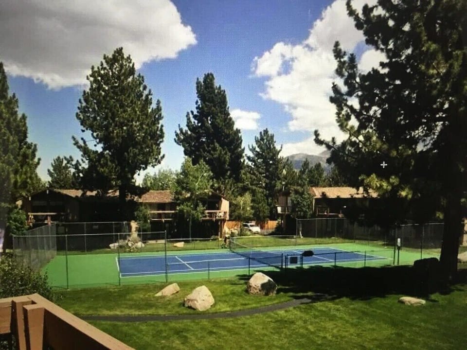 Tennis court in the summer time.  The view from our deck.
