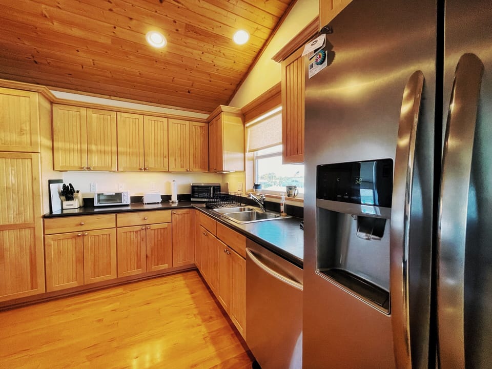 Maple cabinetry, stainless appliances