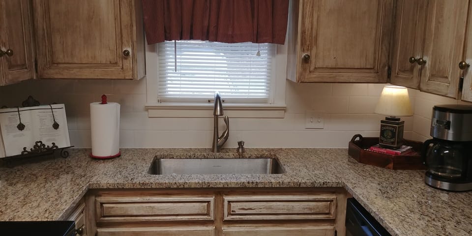 NEW GRANITE AND TILE BACKSPLASH HAVE BEEN ADDED TO OUR KITCHEN
