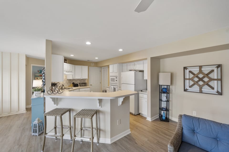 kitchen area with stools 