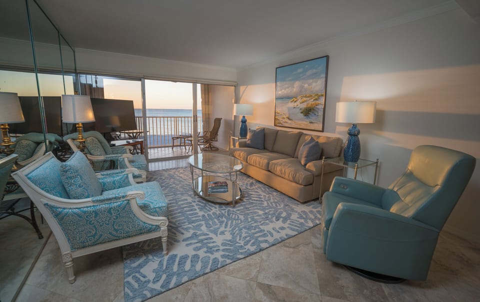 Cozy living room features amazing views of the Gulf!