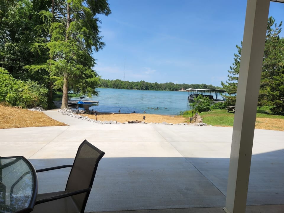 Patio, private beach, dock and fire pit. 
