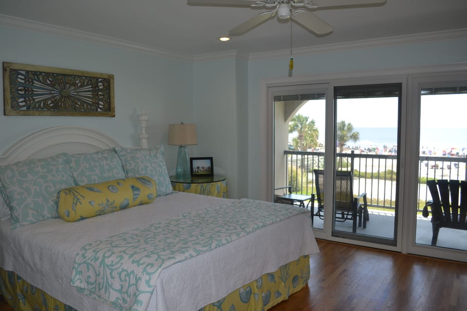 Upstairs master king suite with balcony that overlooks beach