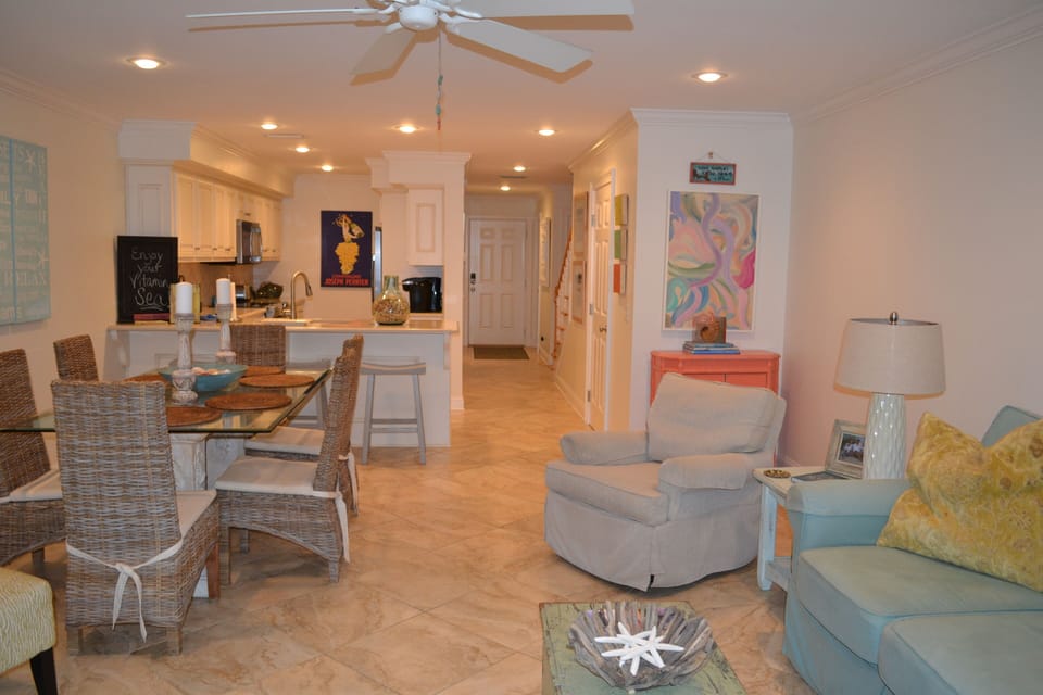 Looking back through living area tokitchen and entrance hall.