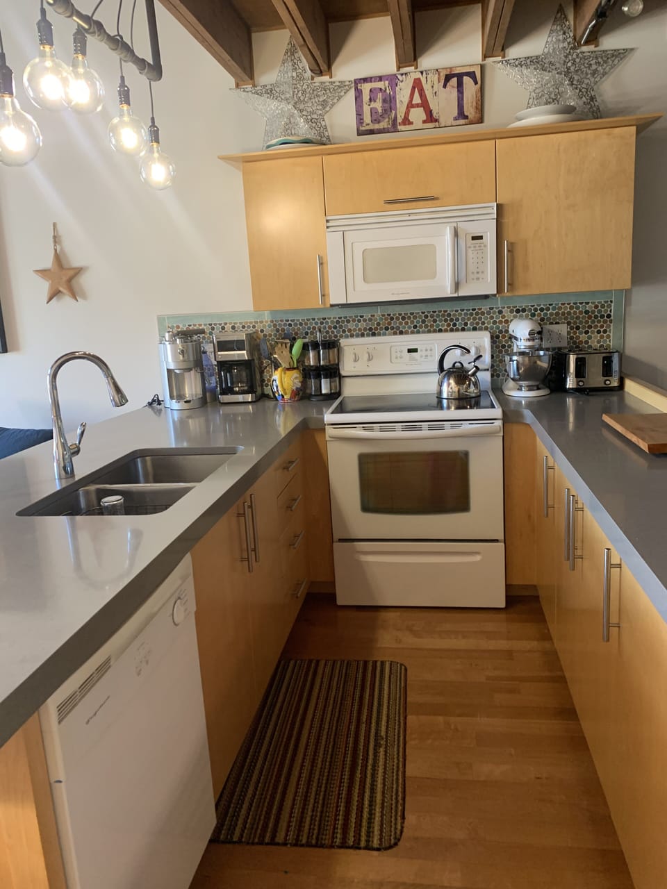 Kitchen area with Quartzite countertops. 