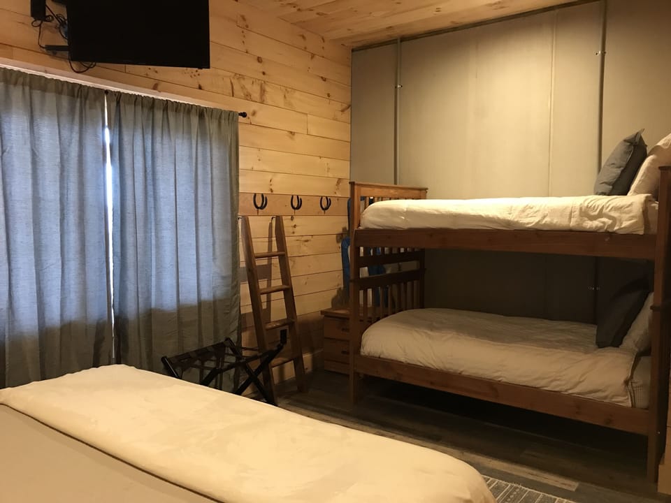 Downstairs bedroom with king and bunk beds 