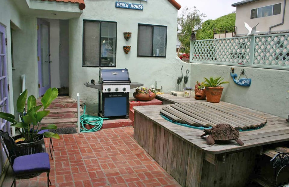 Hot tub and BBQ are in the backyard.