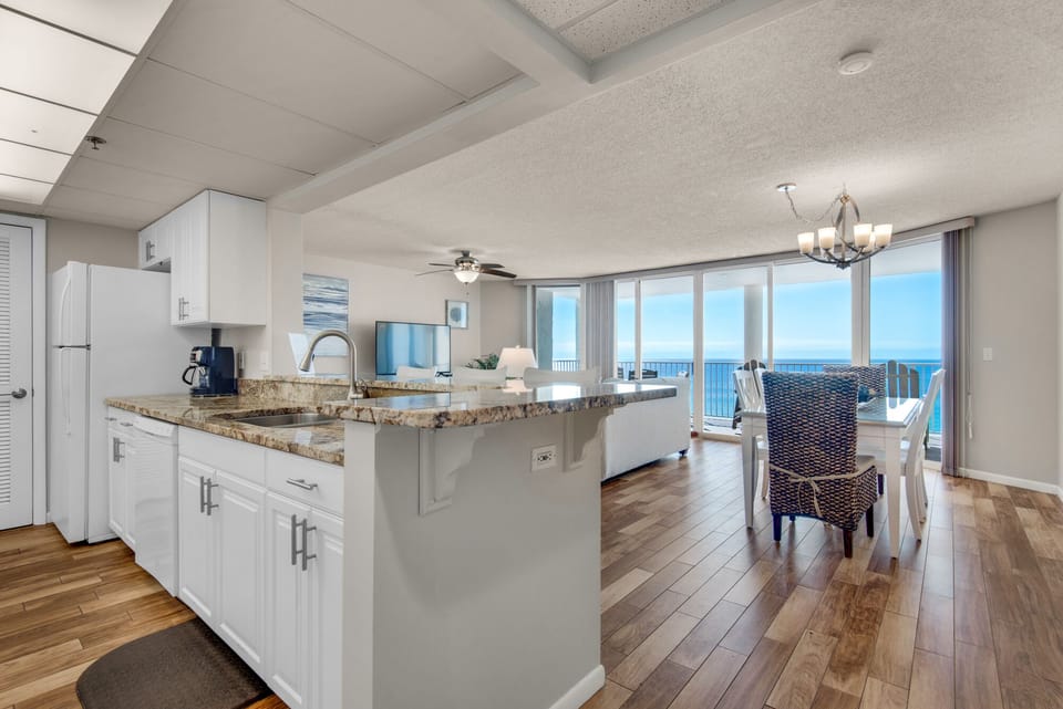 Condo as seen from entry.  Open concept floorplan & wall of windows in all rooms