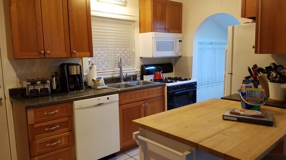 Kitchen w/archway and one step down into dining room
