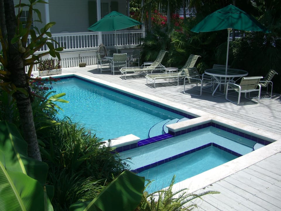 Main Heated Pool, Jacuzzi, Sundeck, Chaise Lounges and Tables and Chairs