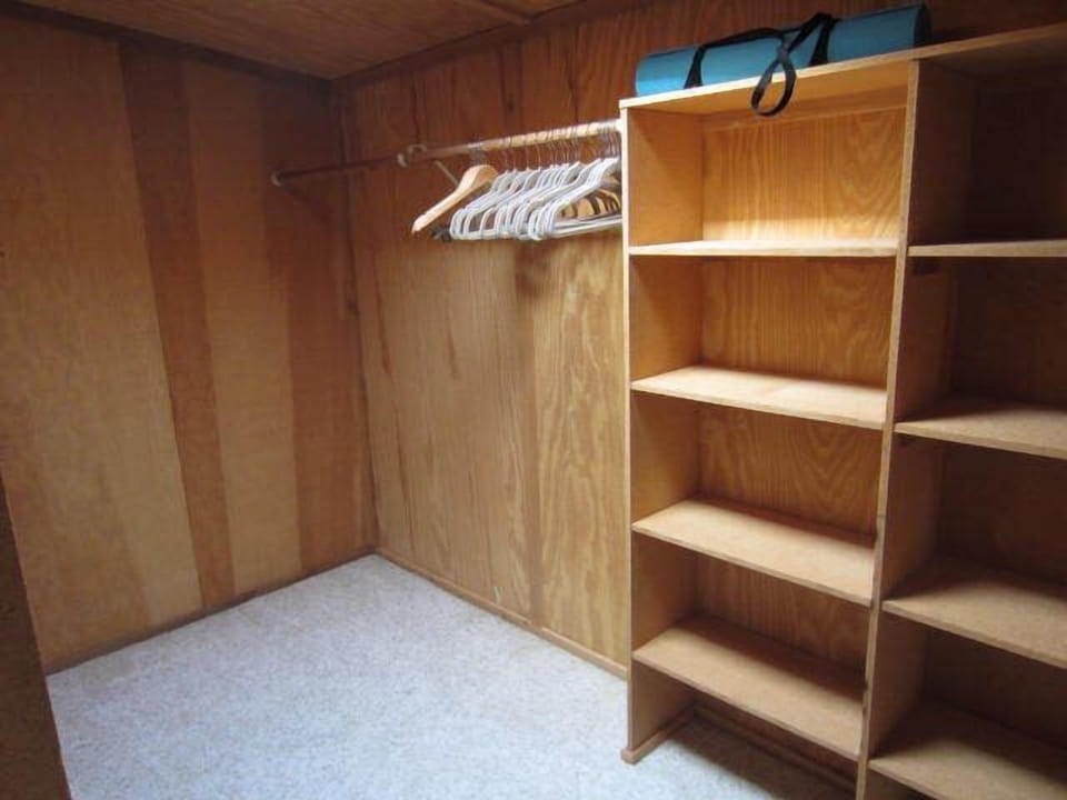 Extra large walk in closet with skylight