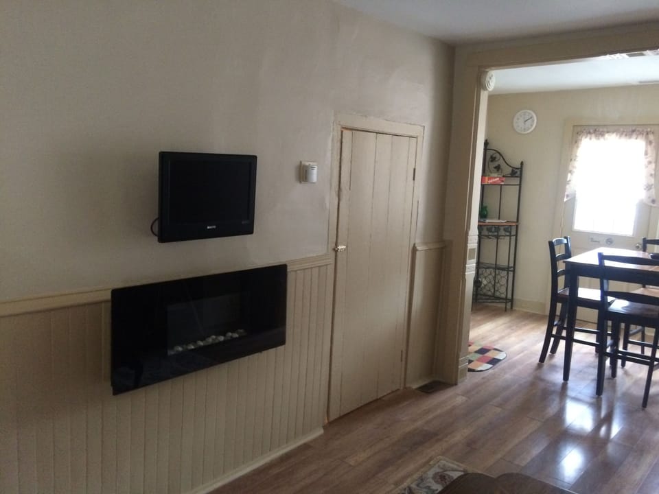 TV has been replaced with a 40" Smart TV and electric fireplace in living room