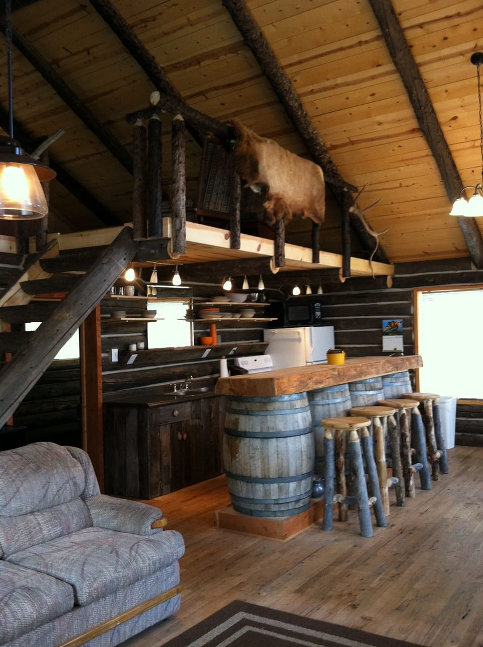Old West wine barrel Bar divides litchen from dining area