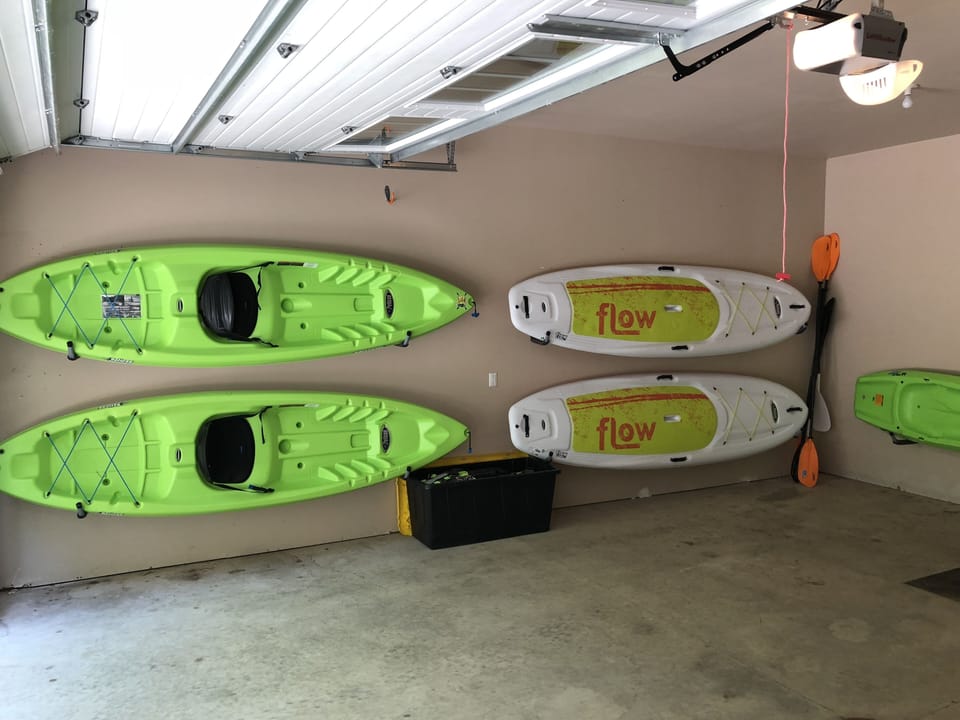 toys! 2 kayaks, 2 paddle boards and a kid kayak