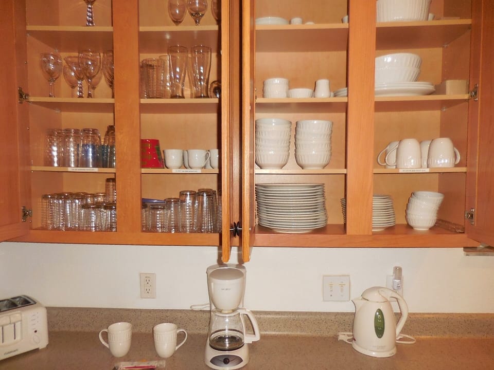 Kitchen has crockery, cutlery, glassware for 10 people.