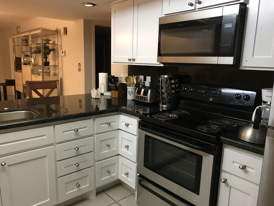 New kitchen with all new stainless appliances and custom cabinets.