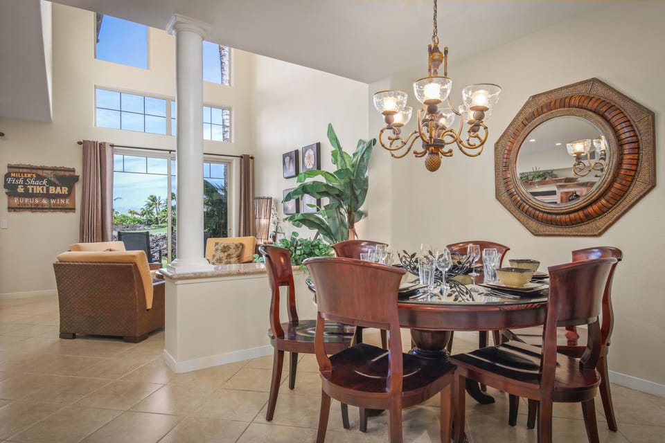 Dining Room with Conversation area and lanai in the background.