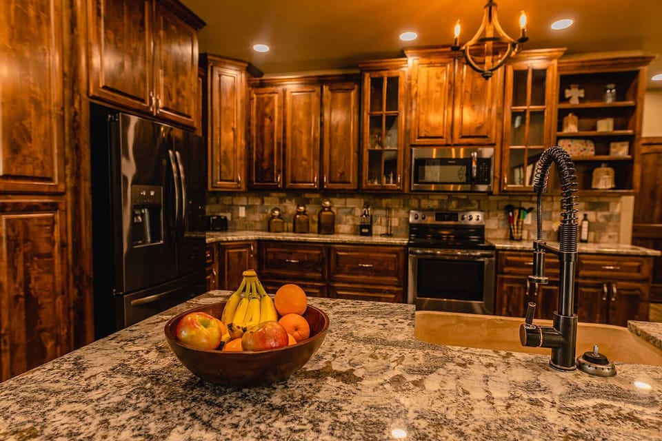 Kitchen has plenty of beautiful custom wood cabinets.  