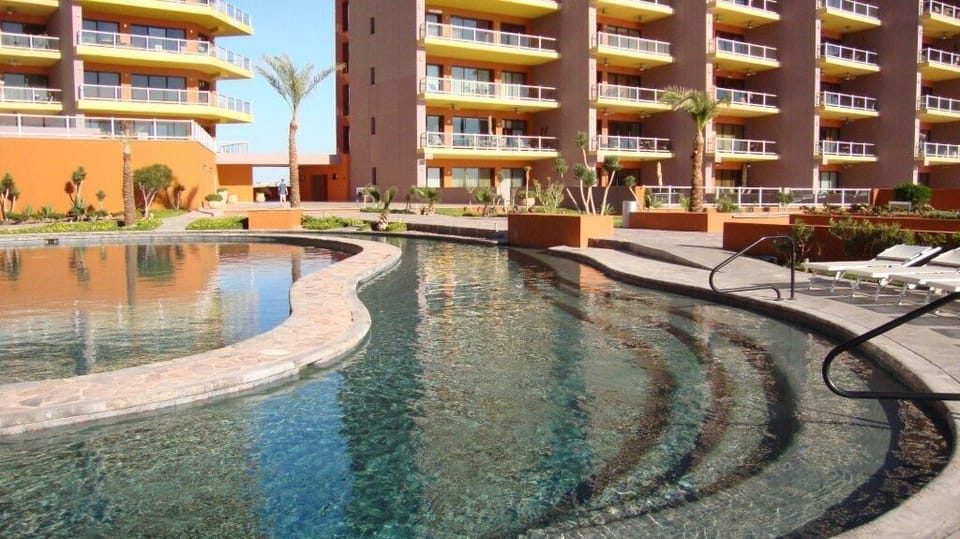 Walk right out the Patio door to lazy river, swim up bar, jacuzzi or Beach!