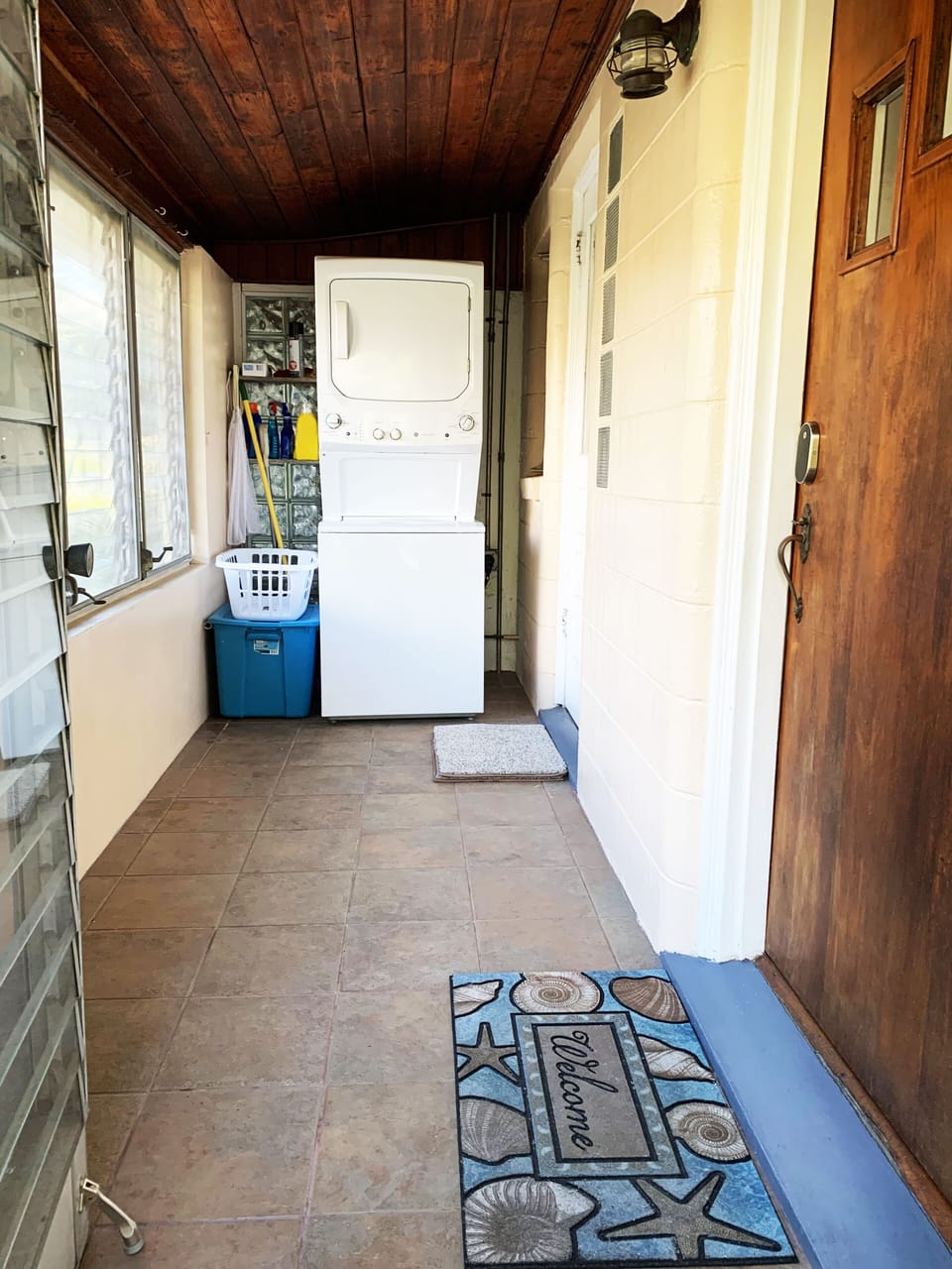 Washer/dryer combo on the covered front porch for your personal use